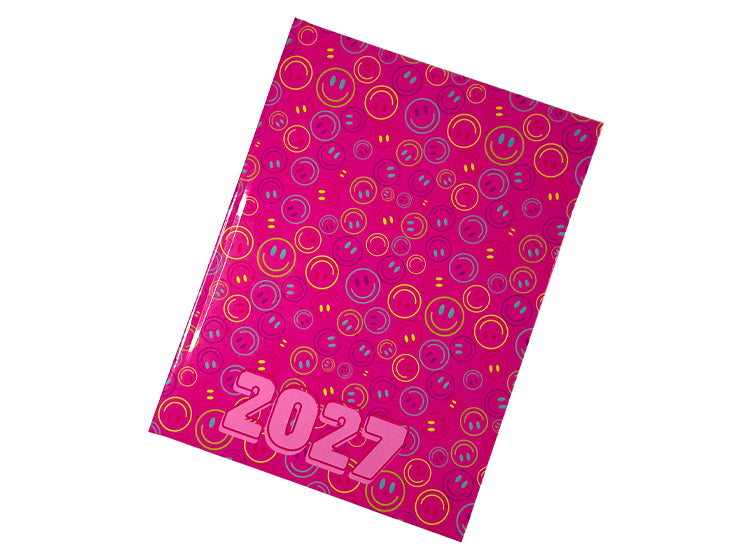An Urban Nomad 2027 A4 page-a-day diary with a bright pink cover decorated with a colorful pattern of smiley faces and concentric circles, shown on a plain white background.