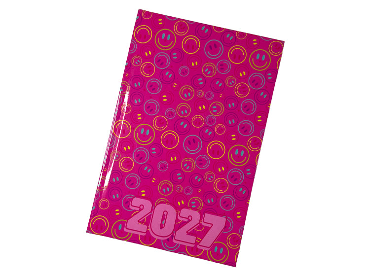 A 2027 A5 diary with a vibrant magenta cover patterned with colorful smiley faces and the year '2027' printed in large pink letters at the bottom.
